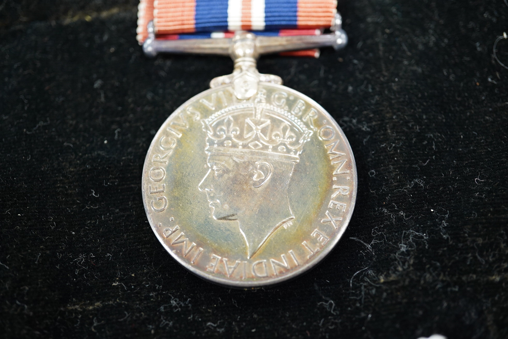 A group of five framed medals including the 1939 to 1945 Canada voluntary service medal, awarded to Private R.E. Bent, 48 Highlanders. Condition - fair to good